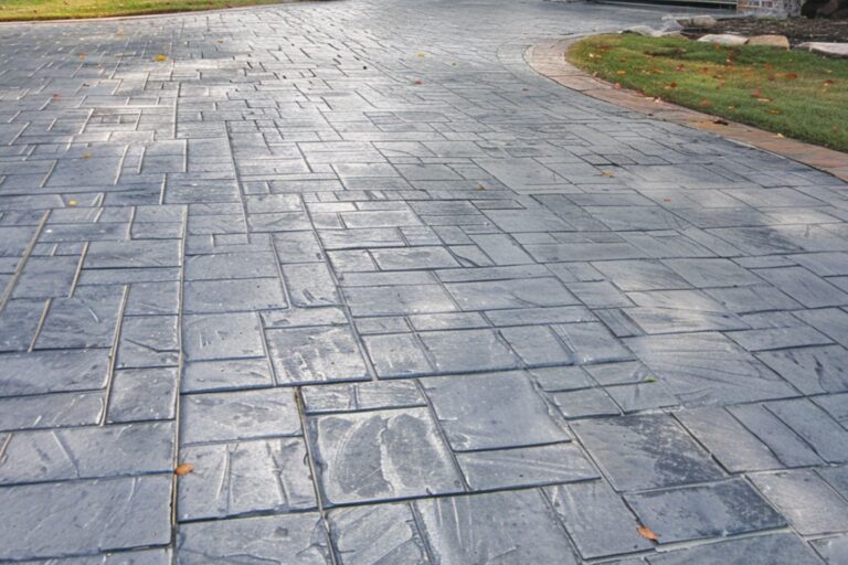 Gray-colored stamped concrete driveway