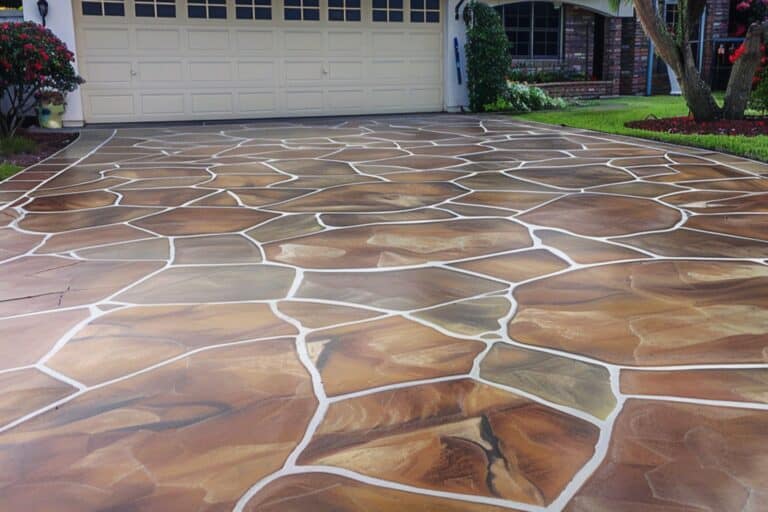 An aesthetic patterned stained and painted concrete driveway