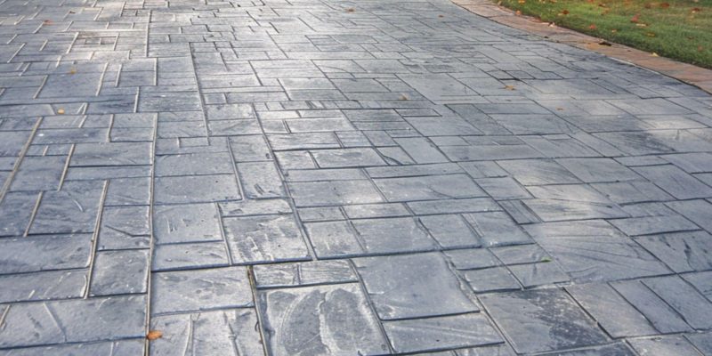 Gray-colored stamped concrete driveway